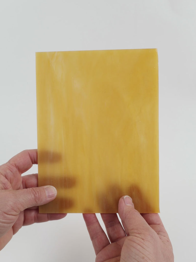 Video of the pecan glass plate in amber translucent, 15x19cm, held up and tilted to show its pattern and transparency