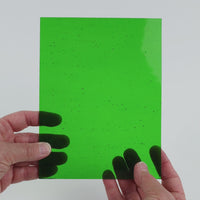 Video of the Deep Kiwi glass plate in transparent green, 15x19cm, held up and tilted to show its pattern and transparency
