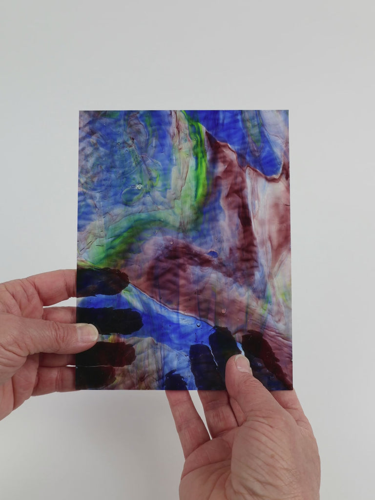 Video of the Navy Gentle Waves glass plate in ripple transparent blue, 15x19cm, held up and tilted to show its pattern and transparency