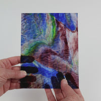 Video of the Navy Gentle Waves glass plate in ripple transparent blue, 15x19cm, held up and tilted to show its pattern and transparency