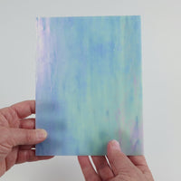 Video of the Heavens Blue glass plate in iridescent translucent blue, 15x19cm, held up and tilted to show its pattern and transparency