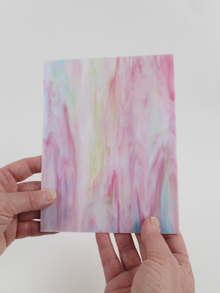 Video of the Sugared Almonds glass plate in translucent pink, 15x19cm, held up and tilted to show its pattern and transparency