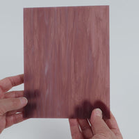 Video of the Shrinking Violet glass plate in translucent purple, 15x19cm, held up and tilted to show its pattern and transparency