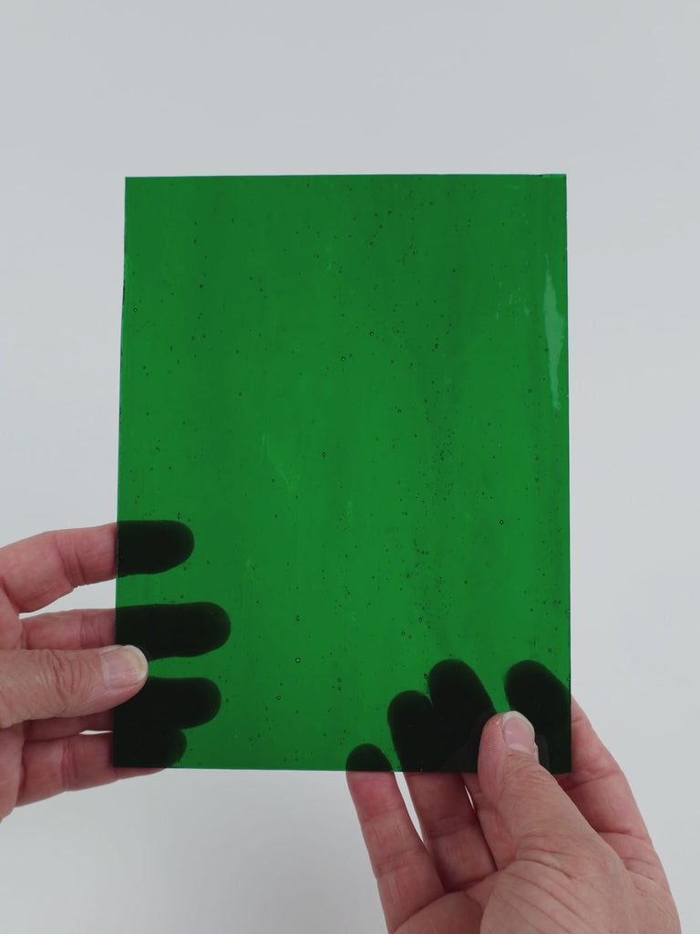 Video of the Deep Emerald glass plate in transparent green, 15x19cm, held up and tilted to show its pattern and transparency