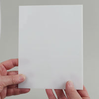 Video of the pure white glass plate in white semi-transparant, 15x19cm, held up and tilted to show its pattern and transparency
